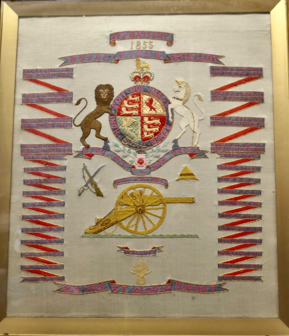 A framed Victorian military silk embroidery panel featuring the Royal Field Artillery coat of arms with lions, unicorns, cannons, and regimental banners within a glazed gilt frame. View VII
