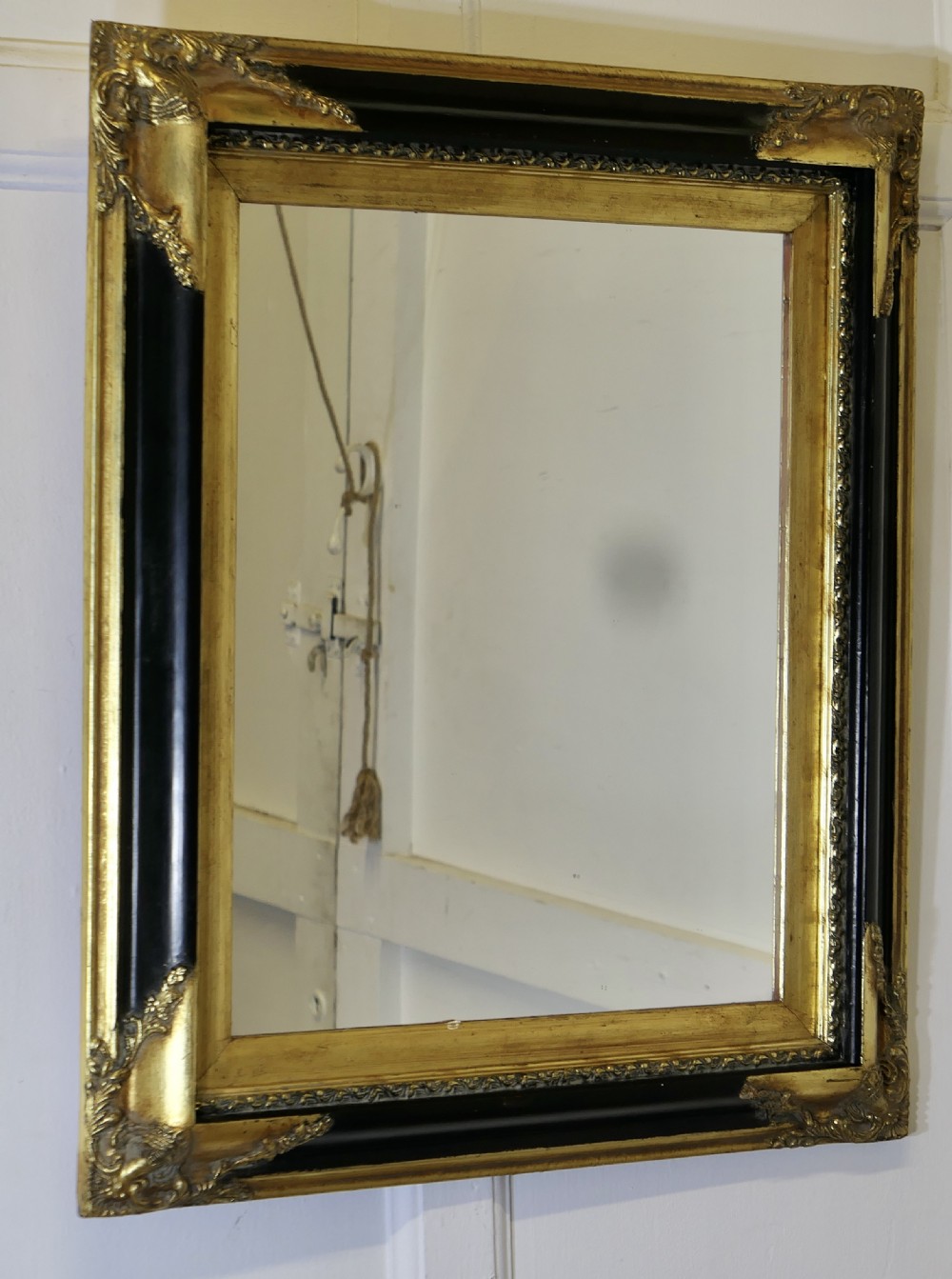 An Elegant Regency Gilt and Black Wall Mirror View II