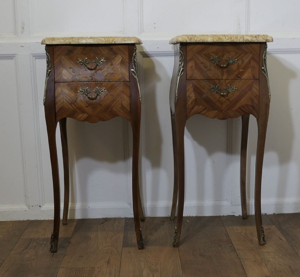 A Pair of French Marquetry Bombe Bedside Cabinets