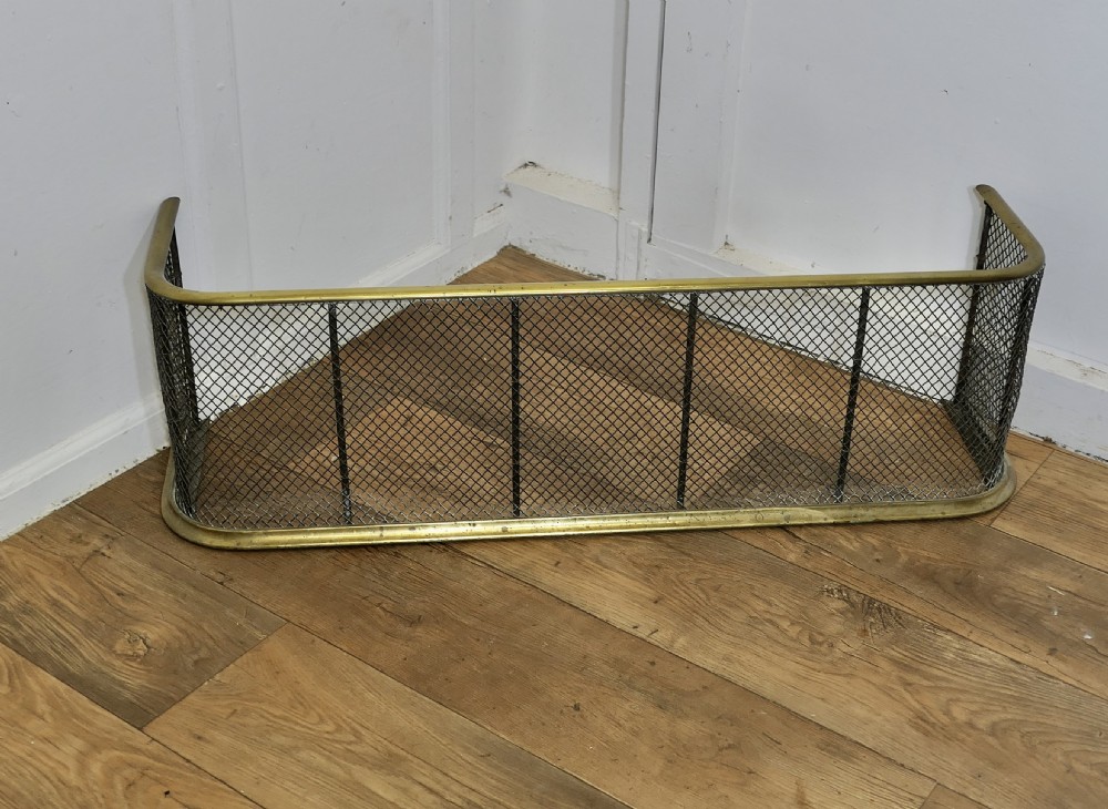 A Victorian Brass and Iron Fender or Fire Guard View II