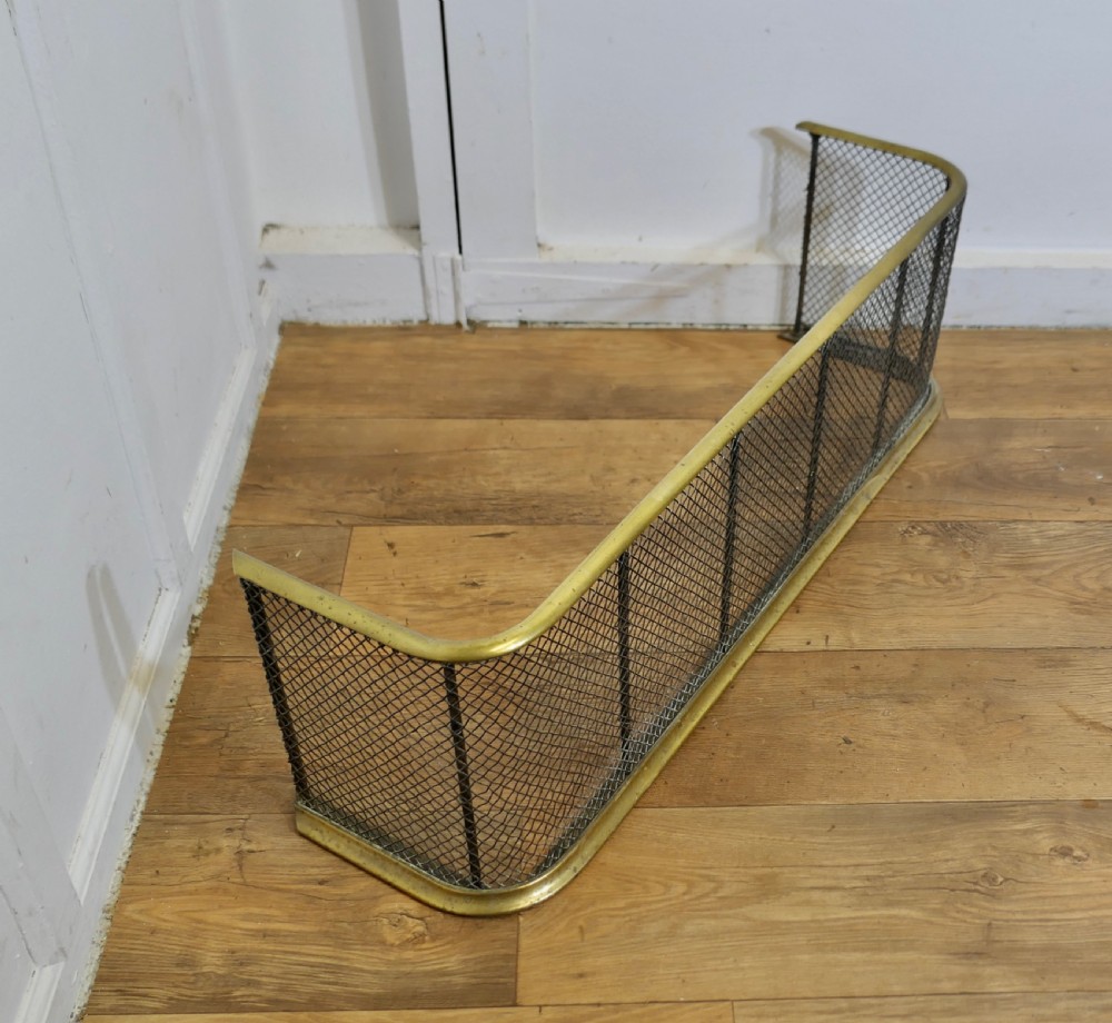 A Victorian Brass and Iron Fender or Fire Guard View III