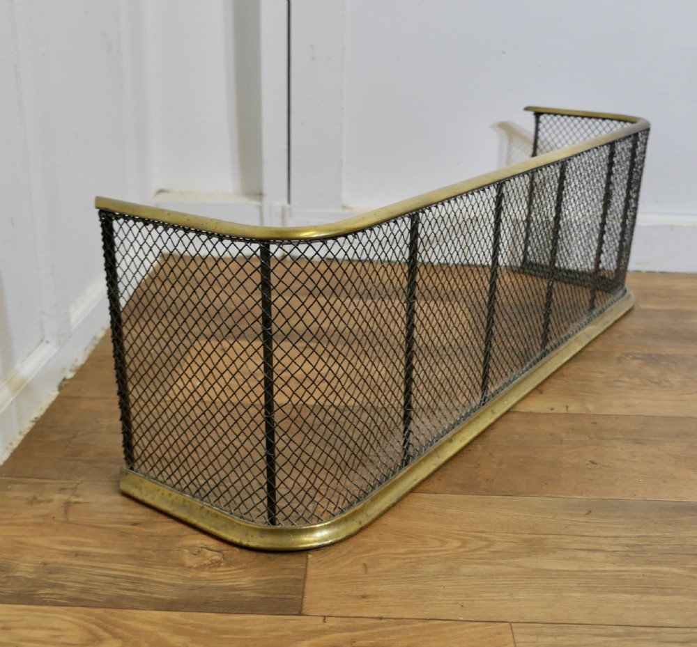 A Victorian Brass and Iron Fender or Fire Guard View IV