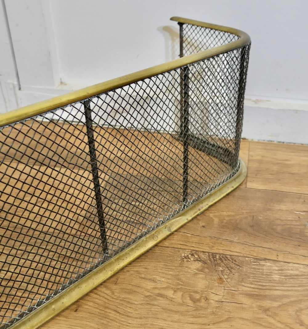A Victorian Brass and Iron Fender or Fire Guard View V
