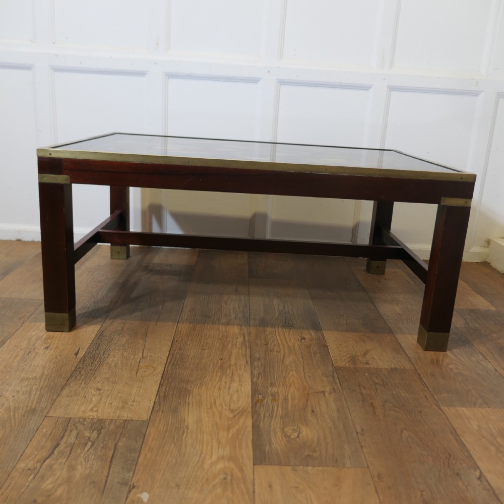 A French nineteenth-century rectangular dark wood low table with fluted tapered legs, brass feet, and a pierced brass gallery around the top edge. View IX
