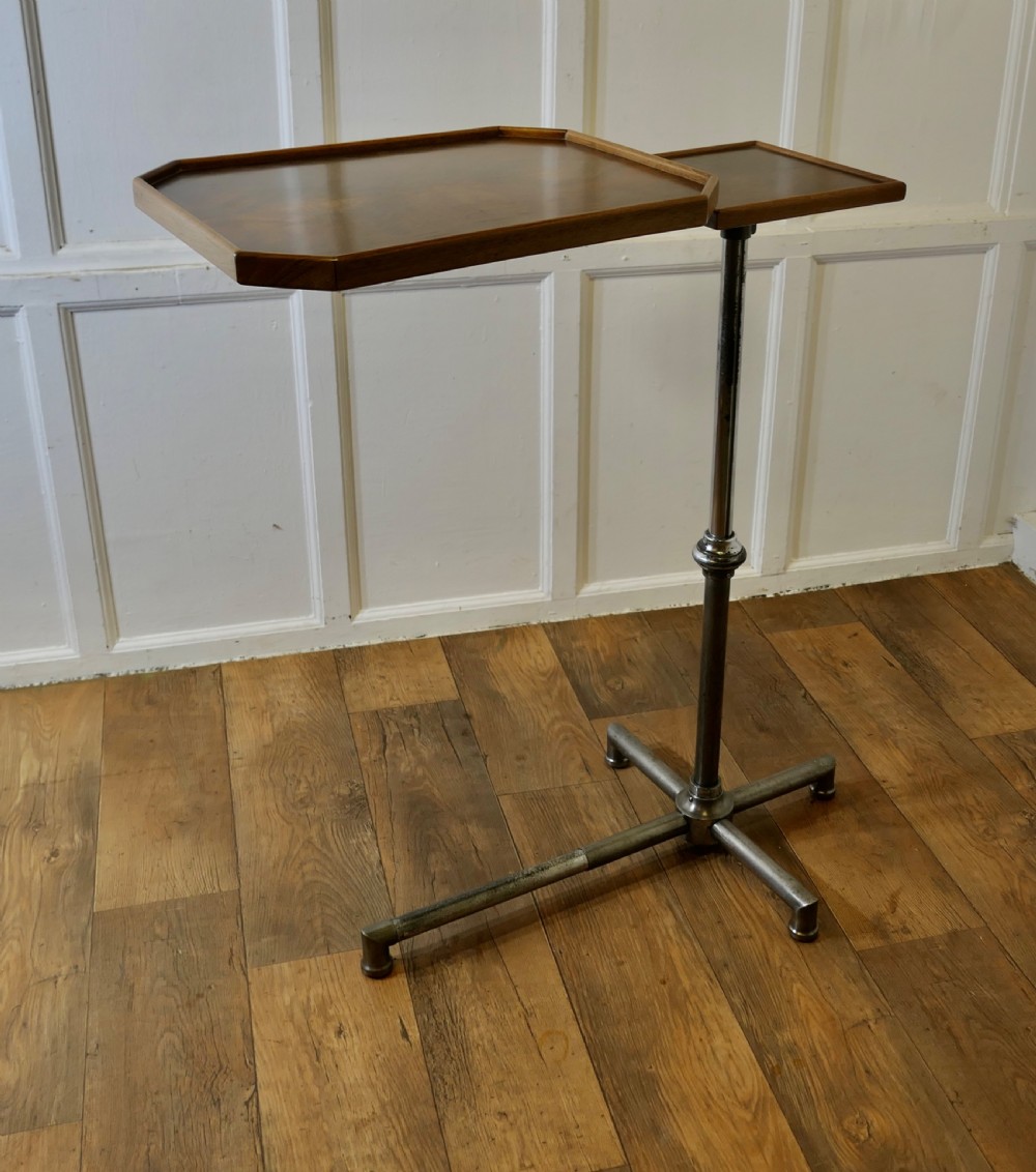 An Art Deco adjustable reading stand featuring two walnut wooden tray tops on a tubular chrome column and cross-form base. View V