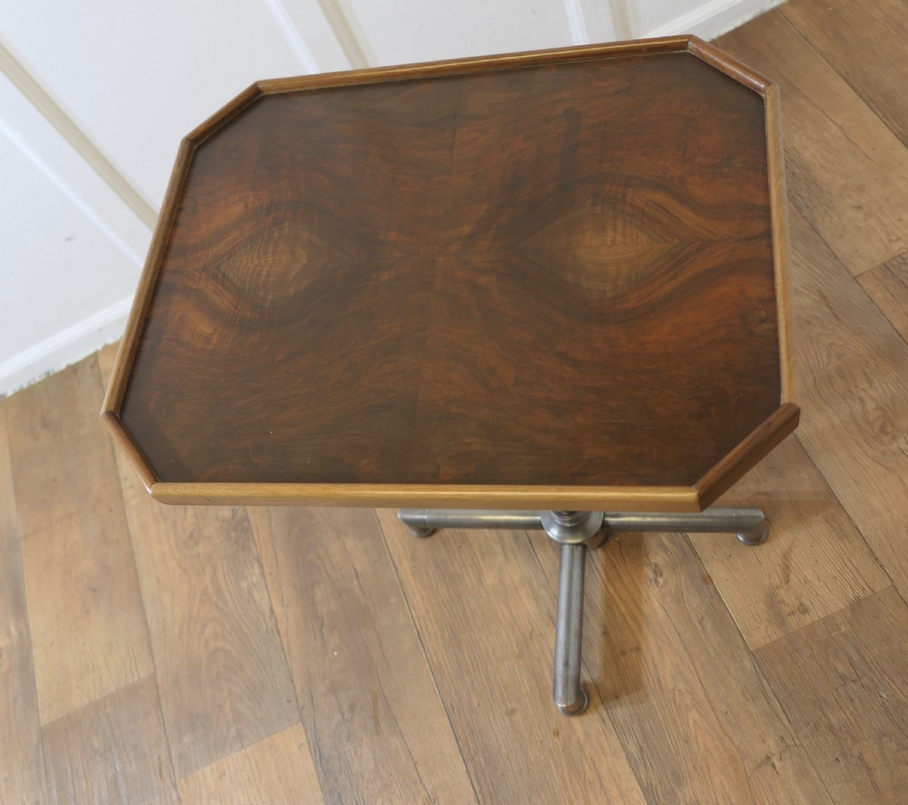 An Art Deco adjustable reading stand featuring two walnut wooden tray tops on a tubular chrome column and cross-form base. View VI