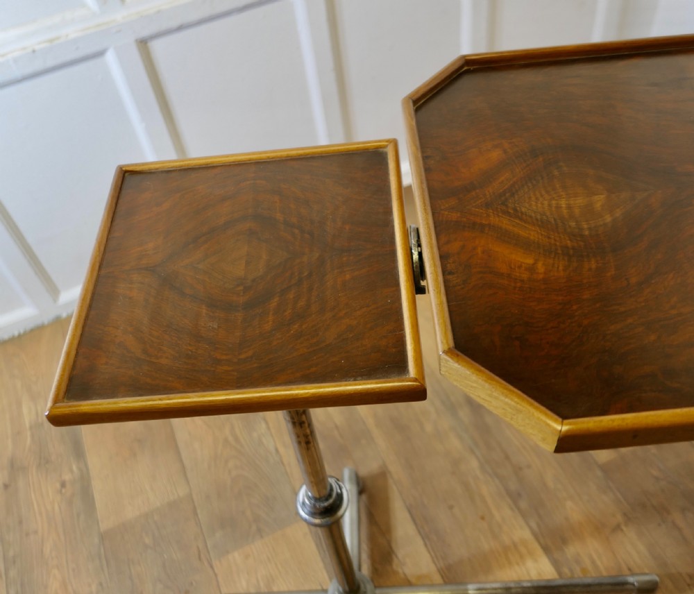 An Art Deco adjustable reading stand featuring two walnut wooden tray tops on a tubular chrome column and cross-form base. View VII