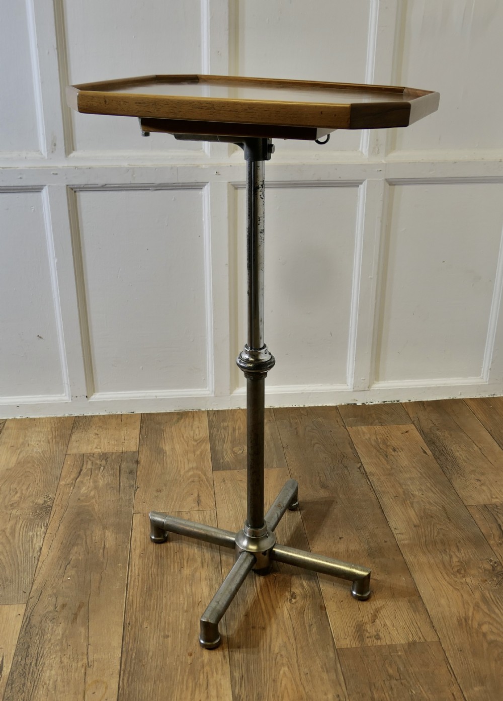 An Art Deco adjustable reading stand featuring two walnut wooden tray tops on a tubular chrome column and cross-form base. View IX