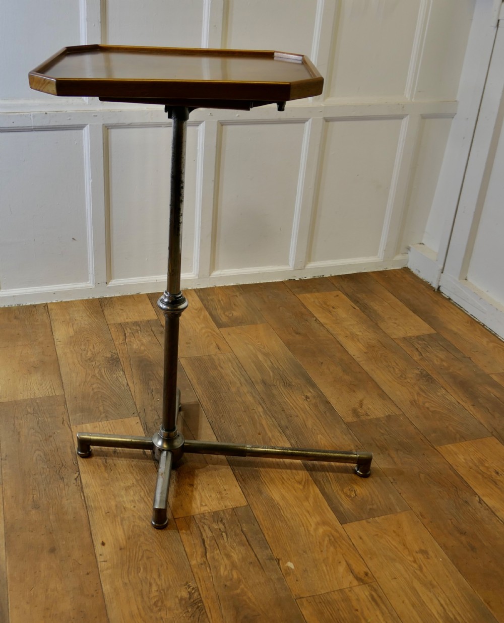 An Art Deco adjustable reading stand featuring two walnut wooden tray tops on a tubular chrome column and cross-form base. View X