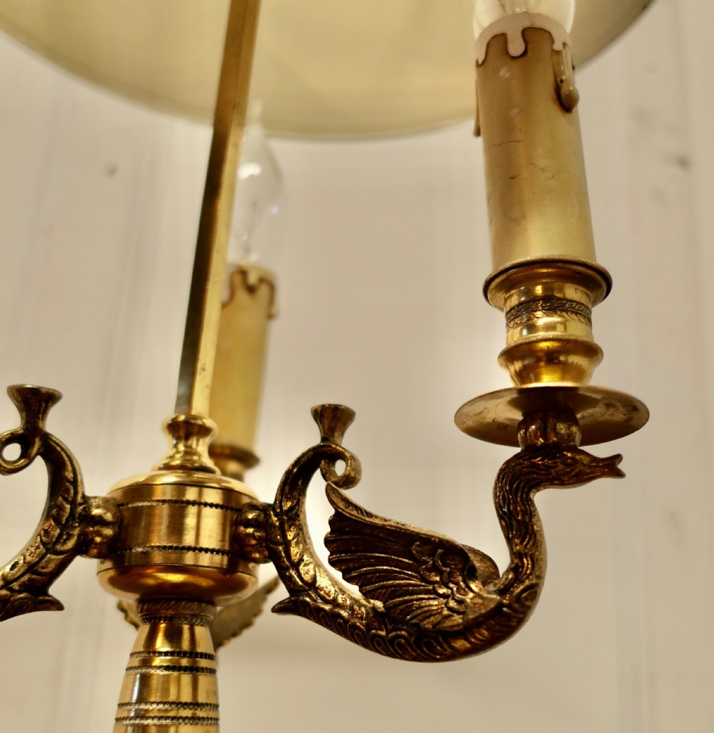 A French toleware and brass bouillotte desk lamp featuring three candle-style lights under a dark green painted metal shade with gilt leaf decoration. View V