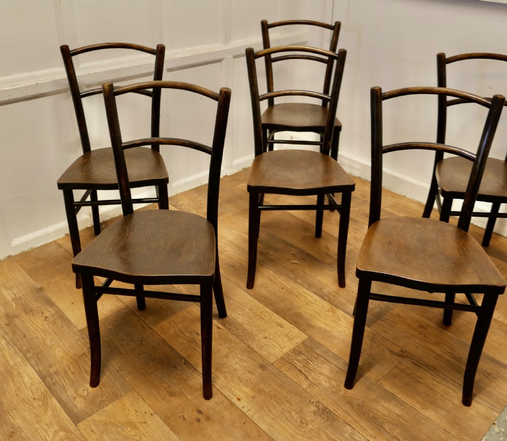 Set of eight dark brown 19th-century Thonet bentwood bistro chairs with steam-bent frames and embossed wooden seats. View IV