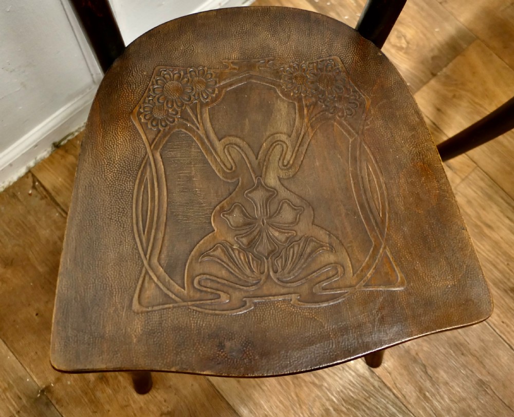 Set of eight dark brown 19th-century Thonet bentwood bistro chairs with steam-bent frames and embossed wooden seats. View VII