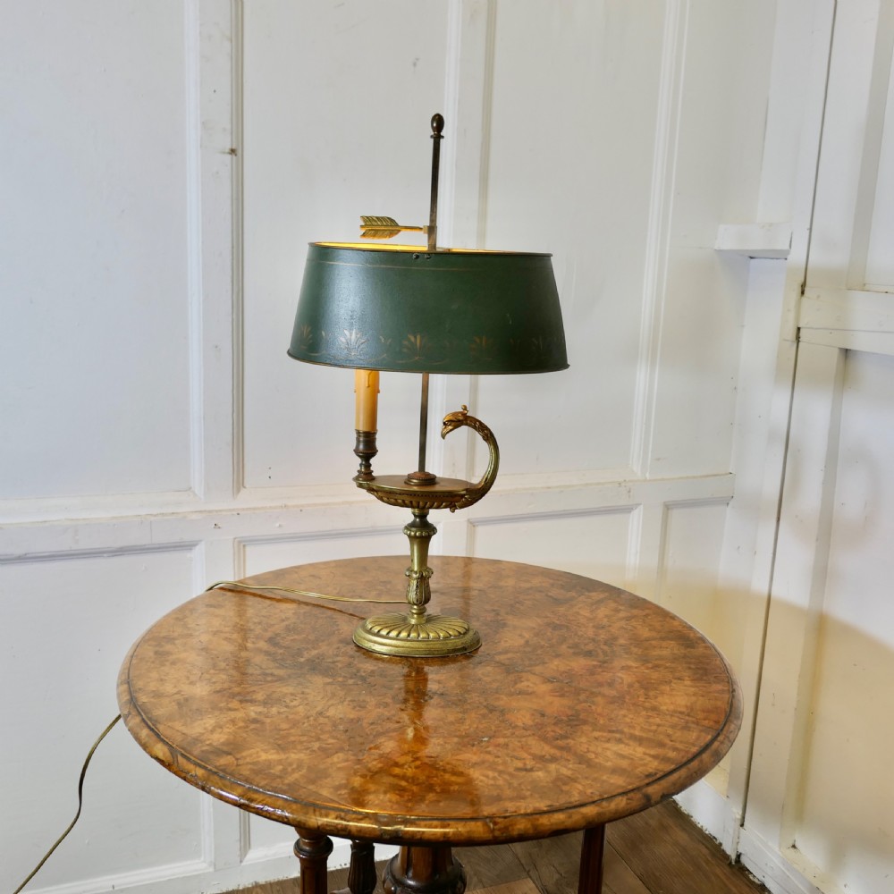 A French Neoclassical desk lamp featuring a dark green painted metal shade with gold stencilling mounted on a cast brass base with a swan-head neck motif. View III