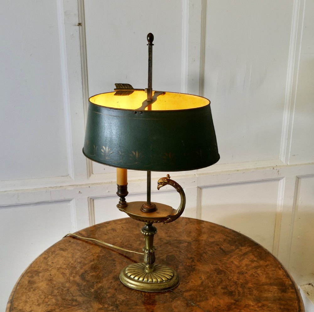 A French Neoclassical desk lamp featuring a dark green painted metal shade with gold stencilling mounted on a cast brass base with a swan-head neck motif. View VII