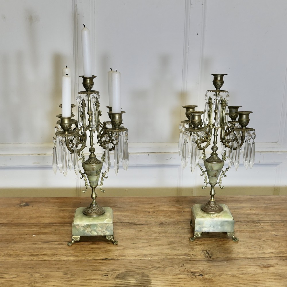 A pair of cast brass five-branch candelabra featuring green onyx stone urns, plinths, and clear crystal glass prisms. View II