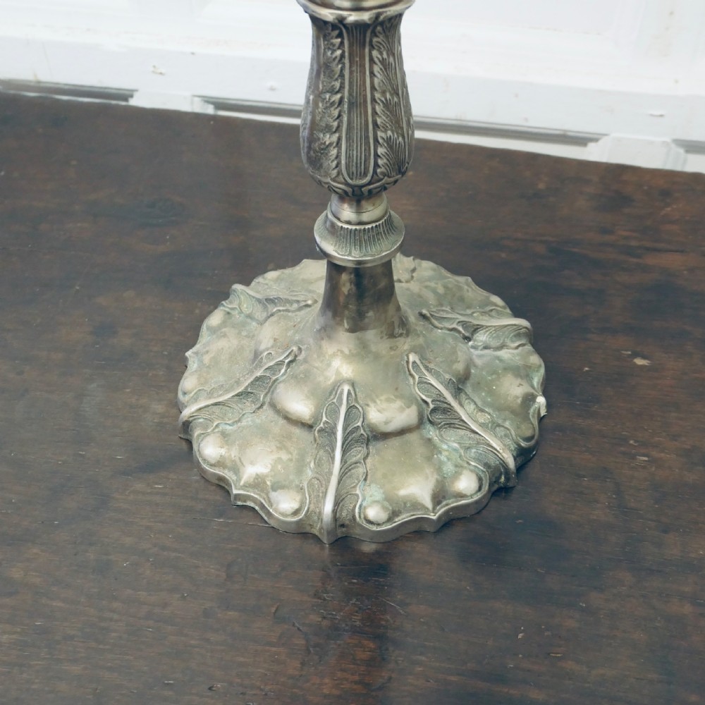 An Art Nouveau silvered metal candelabra featuring five scrolling branches, crystal drip pans with hanging drops, and an ornate fluted central column. View IV