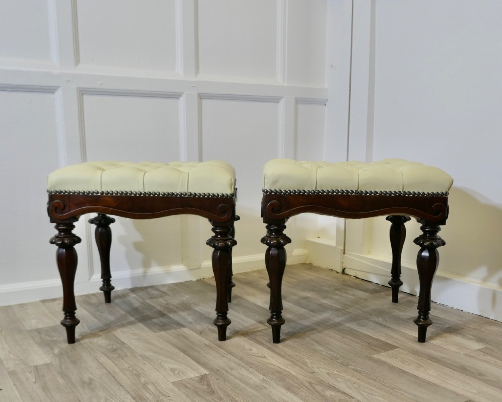 A Pair of Chesterfield Buttoned Leather Walnut Library Window Stools