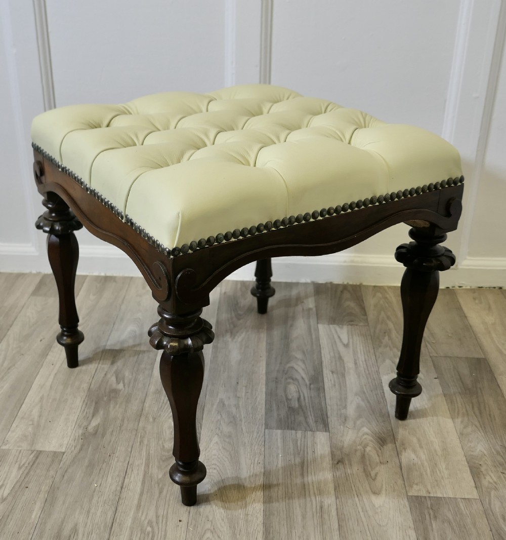 A Pair of Chesterfield Buttoned Leather Walnut Library Window Stools View IV