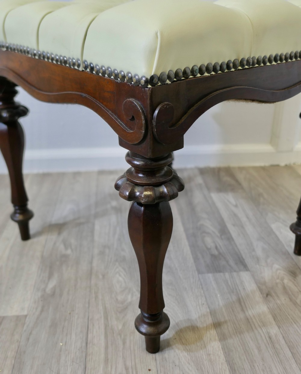A Pair of Chesterfield Buttoned Leather Walnut Library Window Stools View V