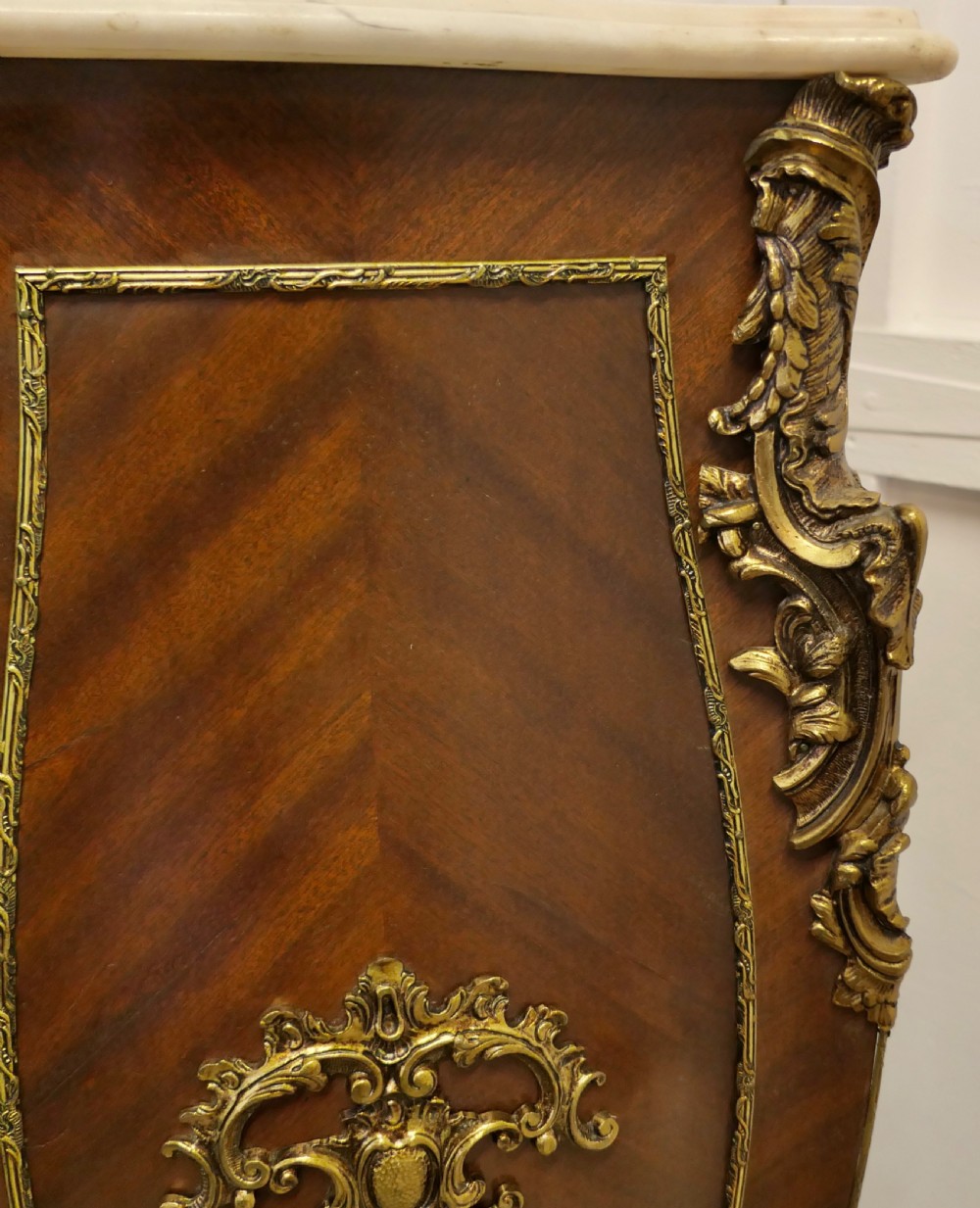 A tall French Rococo style walnut pedestal featuring a marble top, chevron wood veneer, and intricate gilt-bronze ormolu mounts. View IV