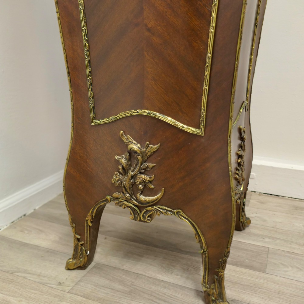 A tall French Rococo style walnut pedestal featuring a marble top, chevron wood veneer, and intricate gilt-bronze ormolu mounts. View VIII