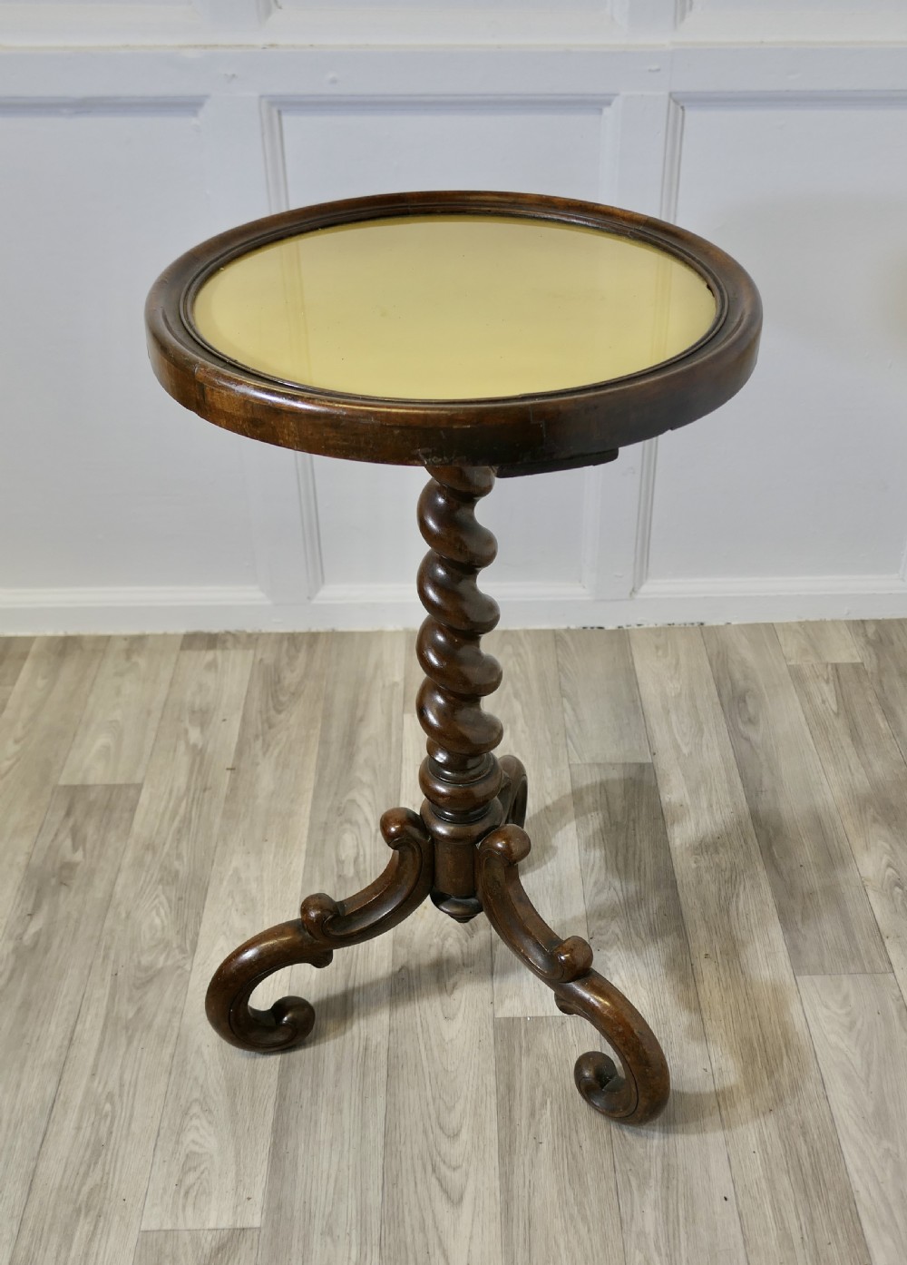 A Victorian dark wood circular wine table featuring a barley twist column and a scrolled tripod base. View VI