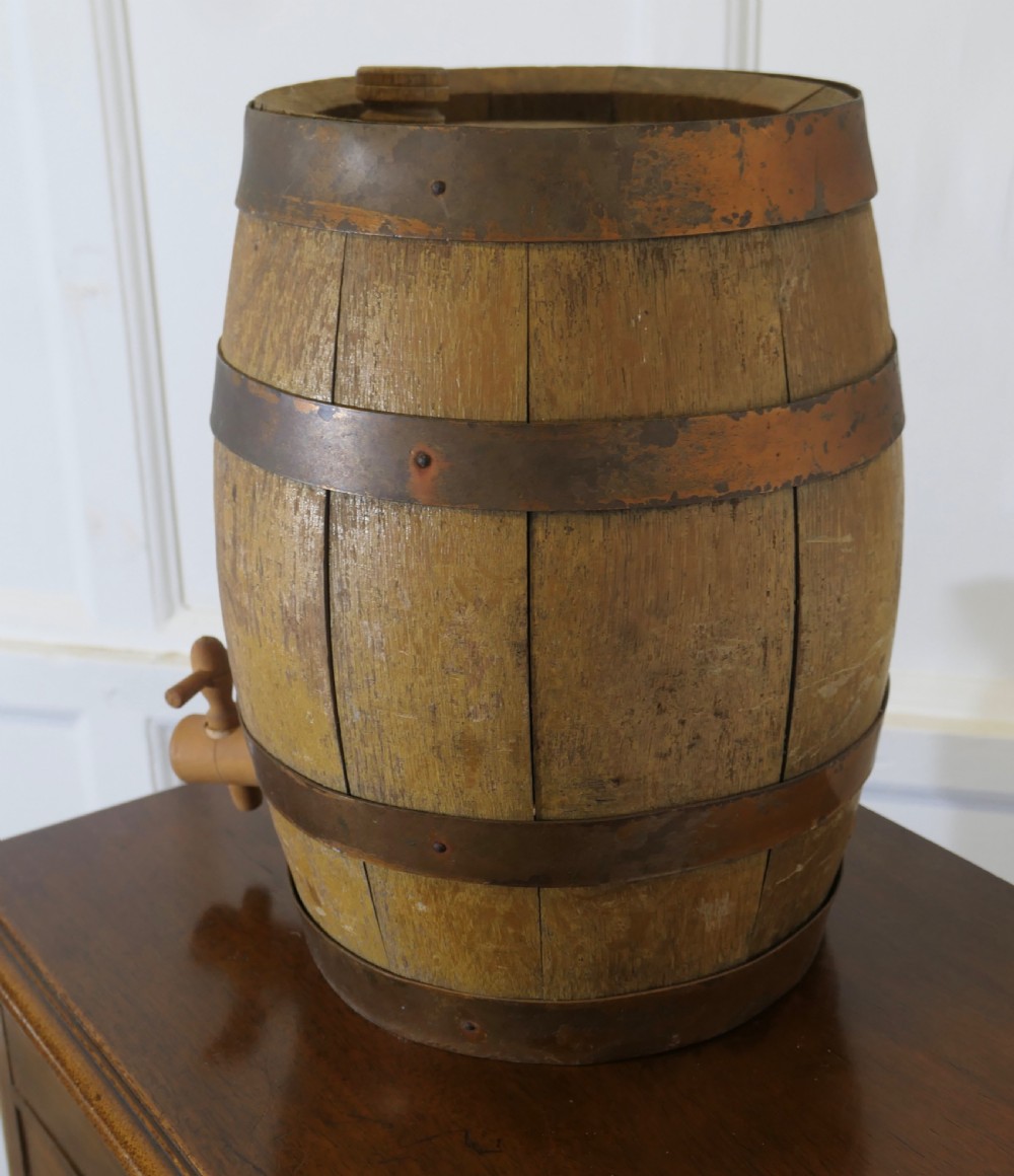 A small oak sherry barrel featuring stencilled text reading RUBIOS SPECIAL AMONTILLADO with metal hoops and a wooden tap. View III
