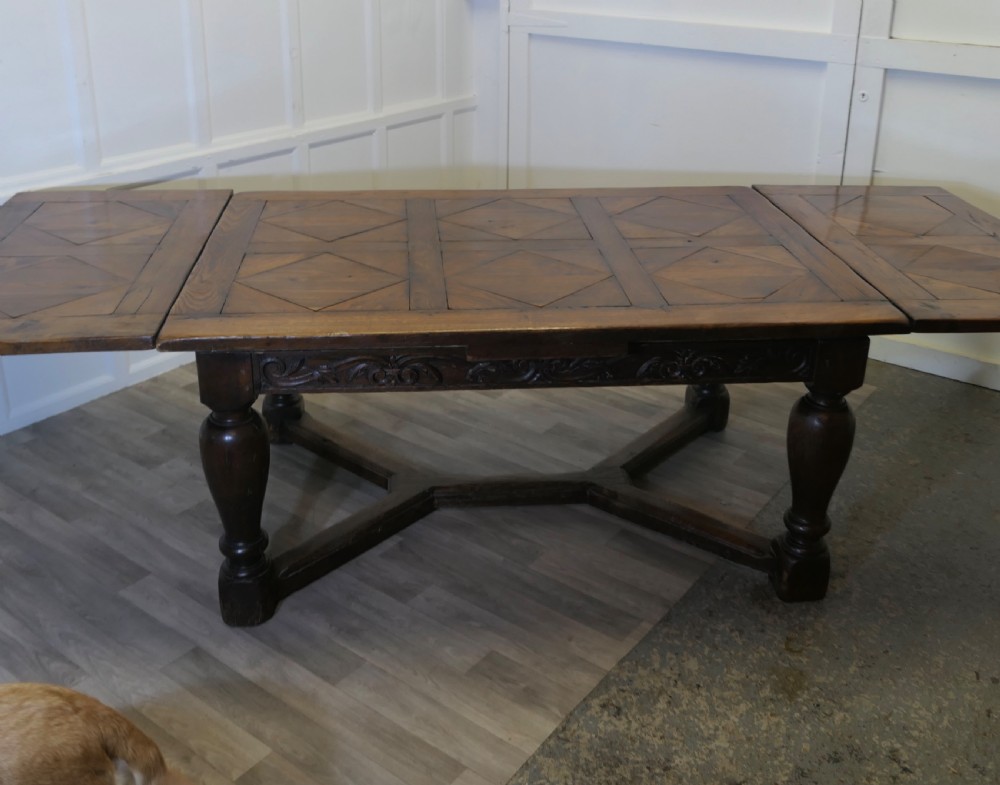  
9ft, 19th Century Carved and Marquetry Oak Draw Leaf Table View II