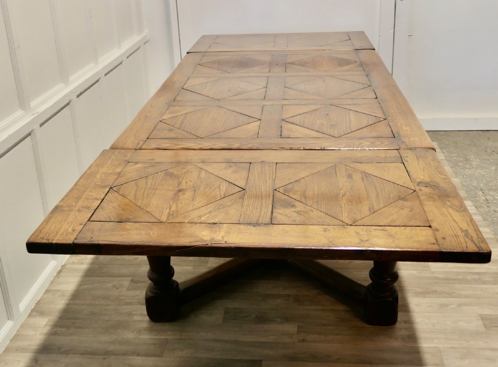  
9ft, 19th Century Carved and Marquetry Oak Draw Leaf Table View IV