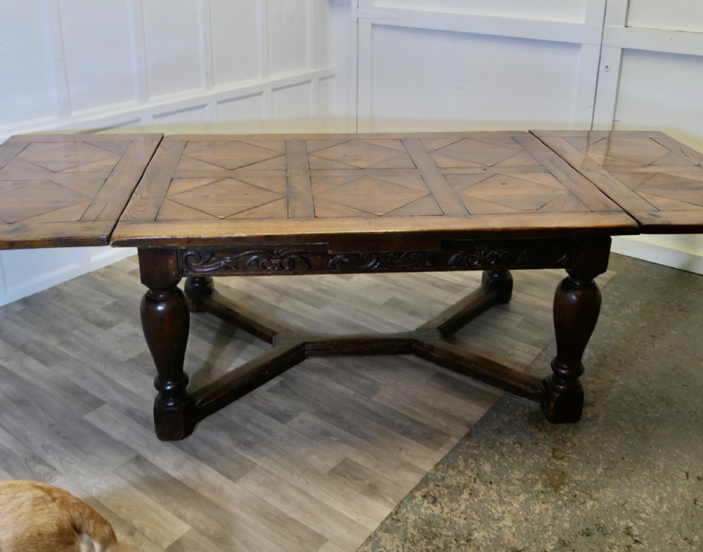  
9ft, 19th Century Carved and Marquetry Oak Draw Leaf Table View IX