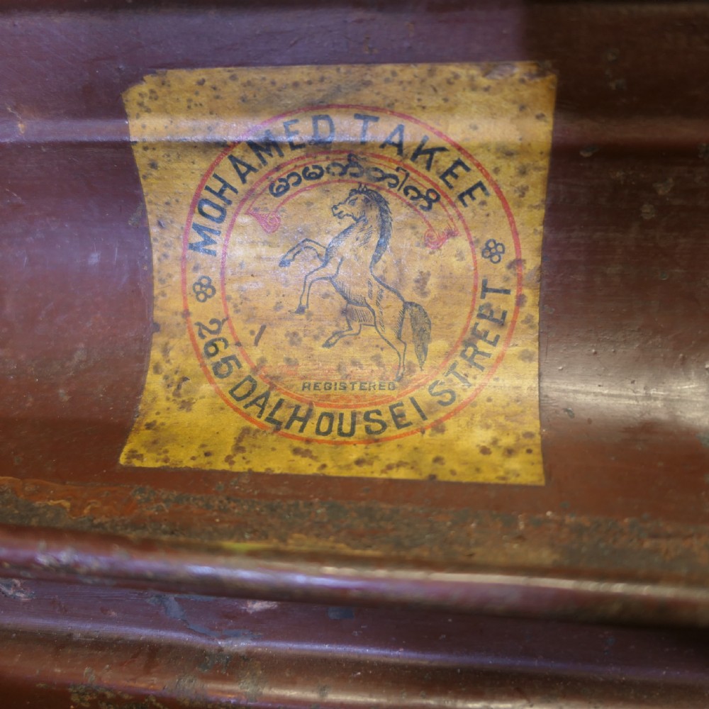 An antique patinated steel travel trunk featuring riveted metal edges, brass latches, and stencilled lettering reading Best Steel. View VI