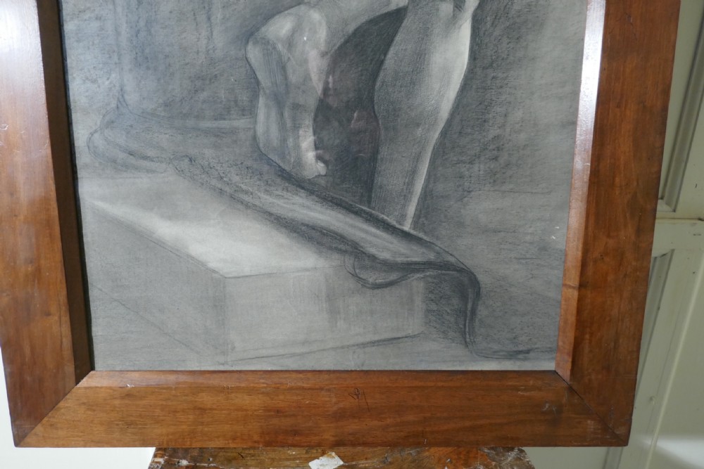 A full-length charcoal study of a standing female nude in profile and back view, set within a polished timber frame. View IV