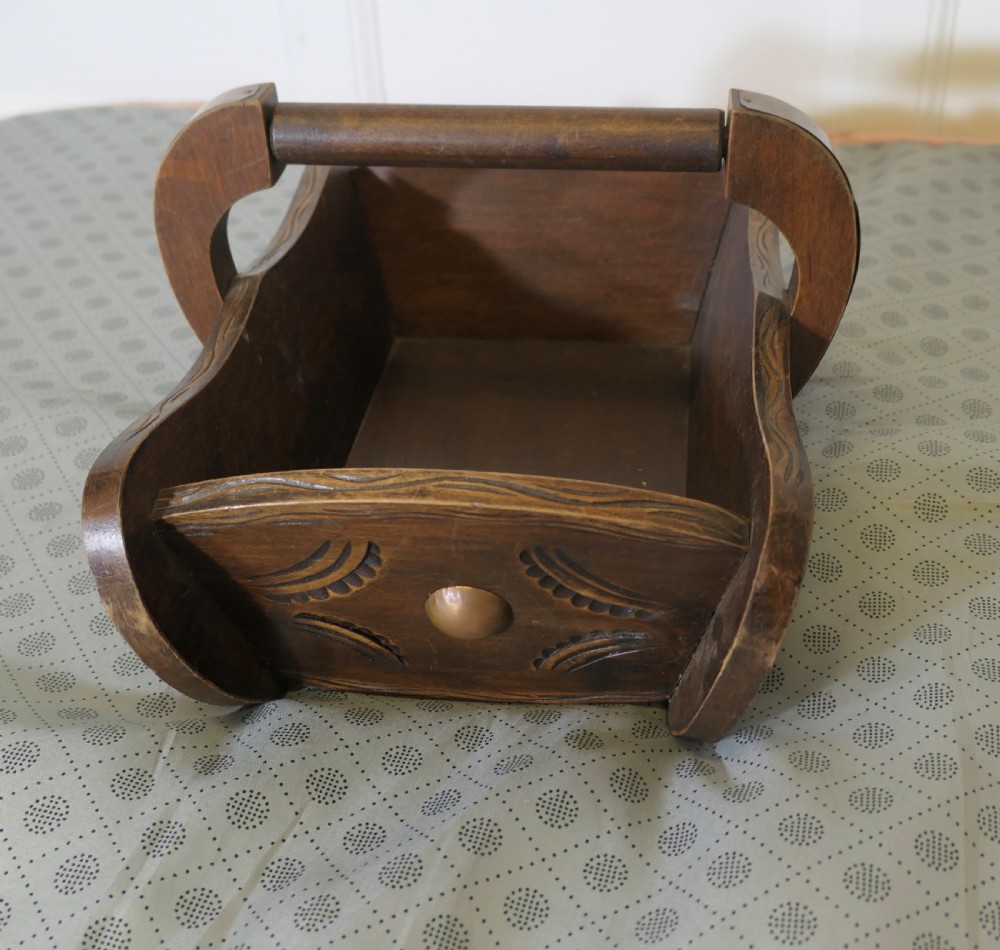 A carved dark oak Arts and Crafts style basket featuring elevated copper stud bosses and a central wooden handle. View IV