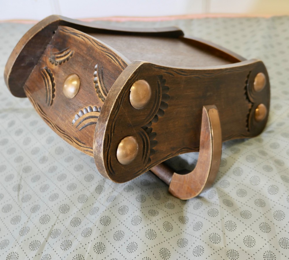 A carved dark oak Arts and Crafts style basket featuring elevated copper stud bosses and a central wooden handle. View V