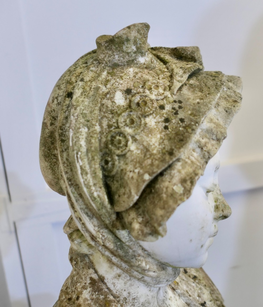 A 19th-century carved Carrara marble portrait bust depicting a young girl wearing a bonnet, mounted on a turned circular socle. View VIII