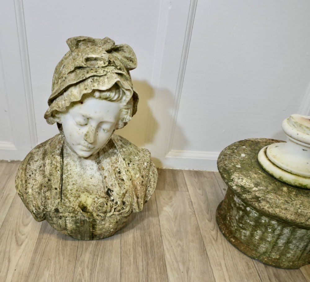 A 19th-century carved Carrara marble portrait bust depicting a young girl wearing a bonnet, mounted on a turned circular socle. View XII