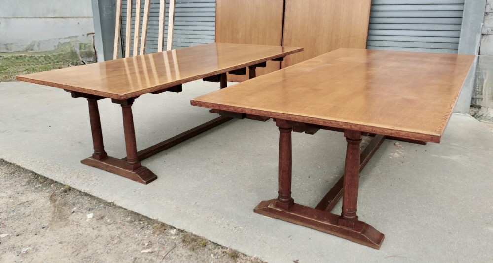 An exceptionally long Arts and Crafts solid oak banqueting table supported by columned trestle bases and structural stretchers. View X