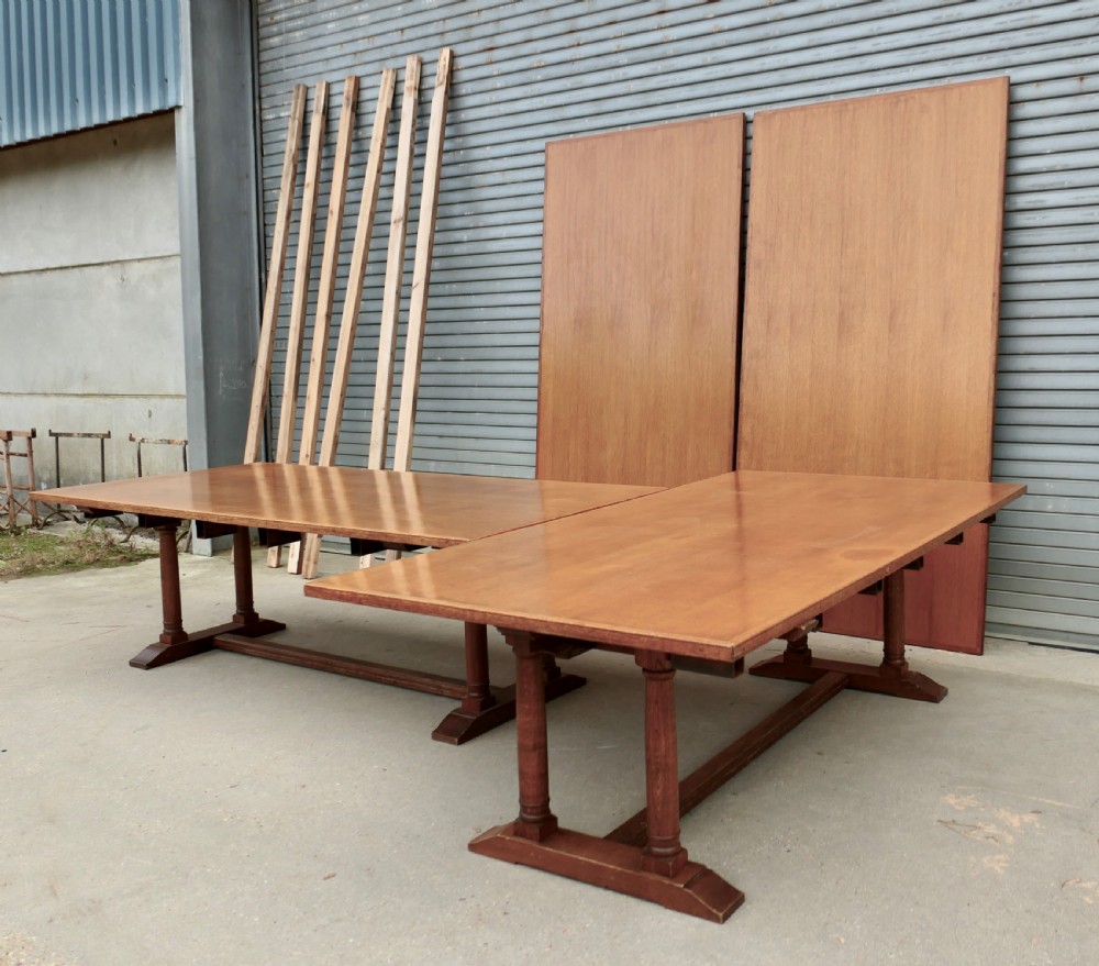 An exceptionally long Arts and Crafts solid oak banqueting table supported by columned trestle bases and structural stretchers. View XIV
