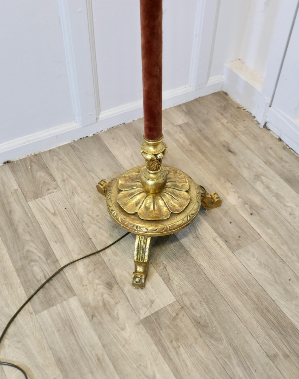 An antique French floor lamp with a gilded metal base, a velvet-wrapped central column, and a pink fabric lampshade featuring detailed fringe tassels. View II