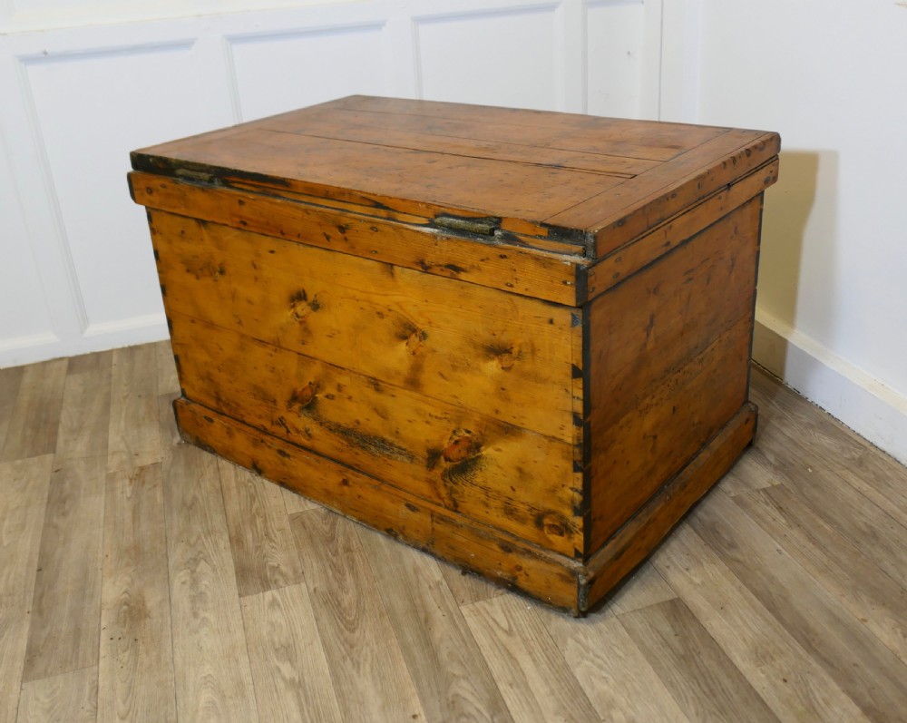 A rectangular Victorian pine carpenters chest featuring visible dovetail joinery, a hinged lid, and a keyhole escutcheon. View IX