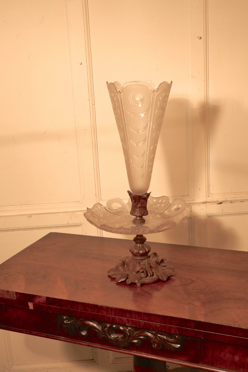 A Victorian Black Forest carved wooden epergne with a leaf base supporting a shallow etched crystal dish and a tall frosted trumpet vase. View III