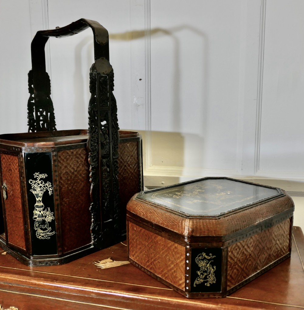 An octagonal Chinese wedding basket constructed from woven bamboo and dark lacquered wood with a tall overhead handle and double doors at the base. View IV