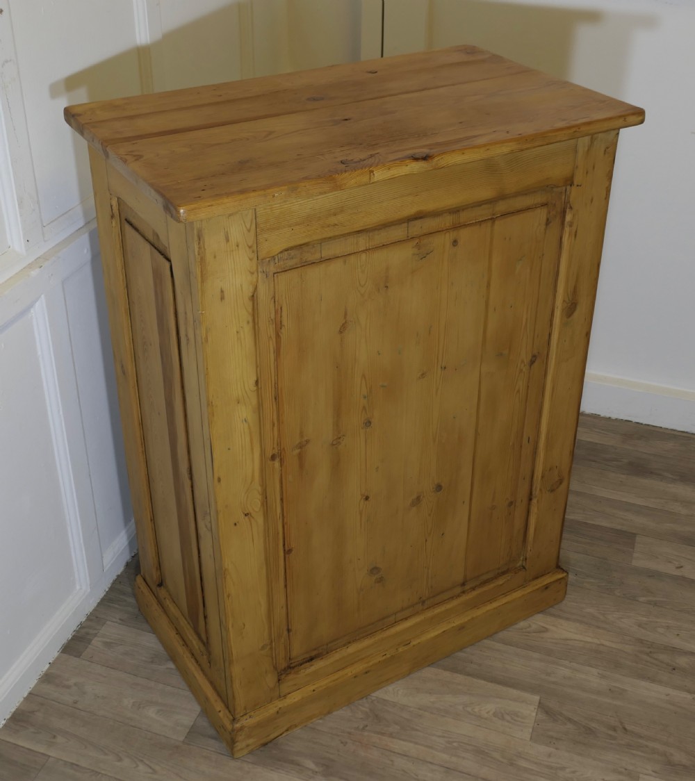 A tall standing pine desk featuring two upper drawers with dark metal cup handles above open lower shelving and panelled sides. View VIII