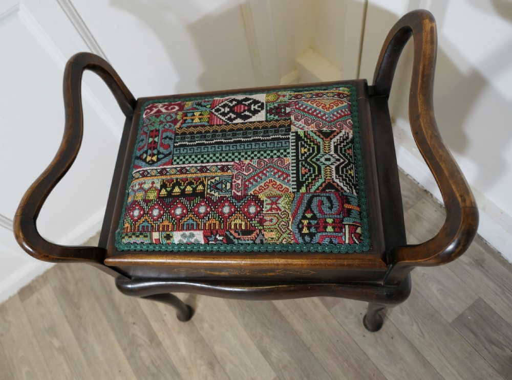 An Edwardian Upholstered Bentwood Piano Stool View III
