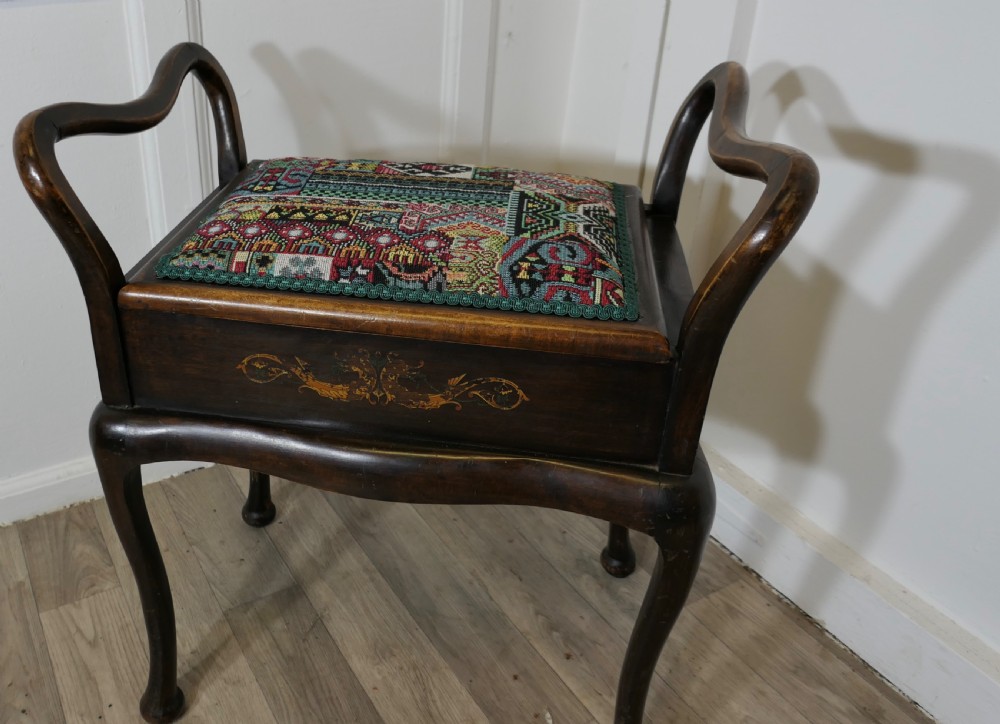 An Edwardian Upholstered Bentwood Piano Stool View V