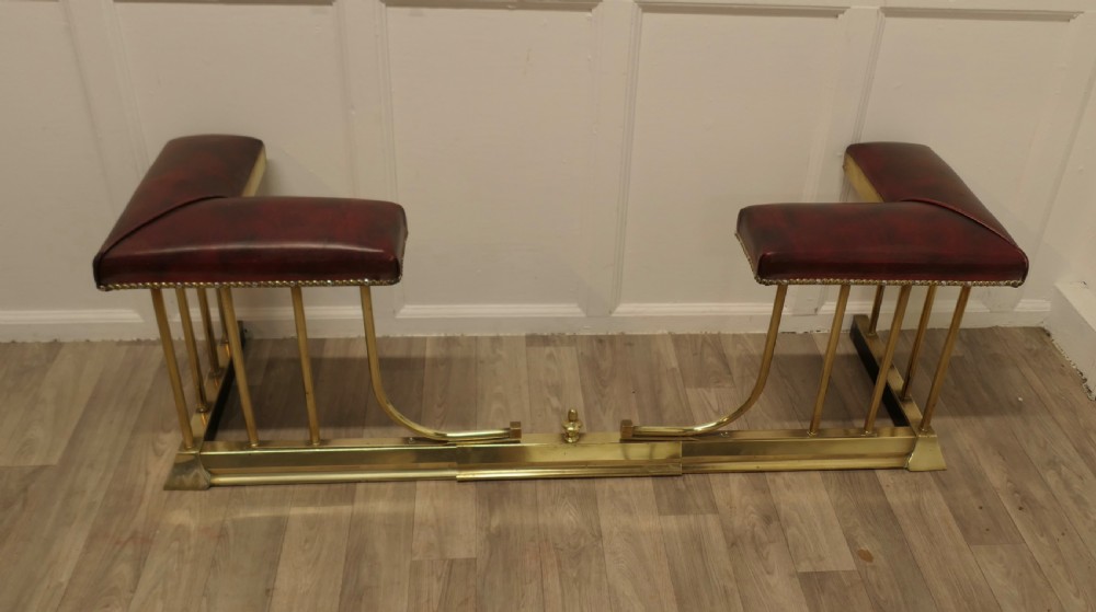 An Extending Brass and Leather Club Fender View III