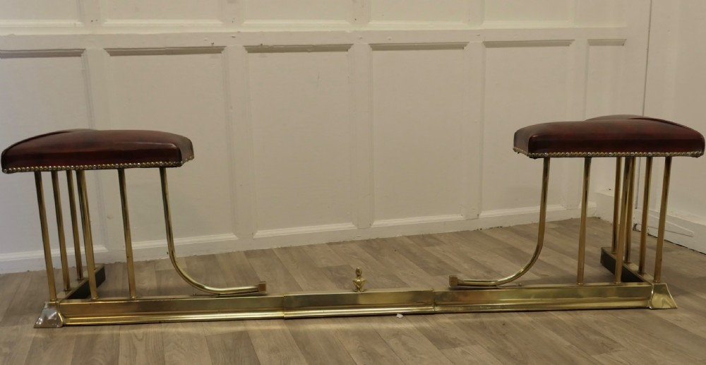 An Extending Brass and Leather Club Fender View V
