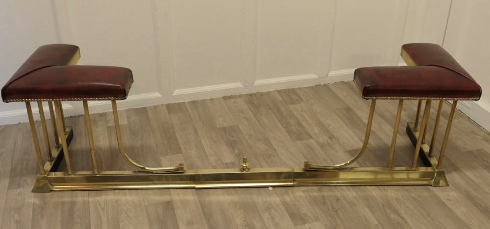An Extending Brass and Leather Club Fender View VI
