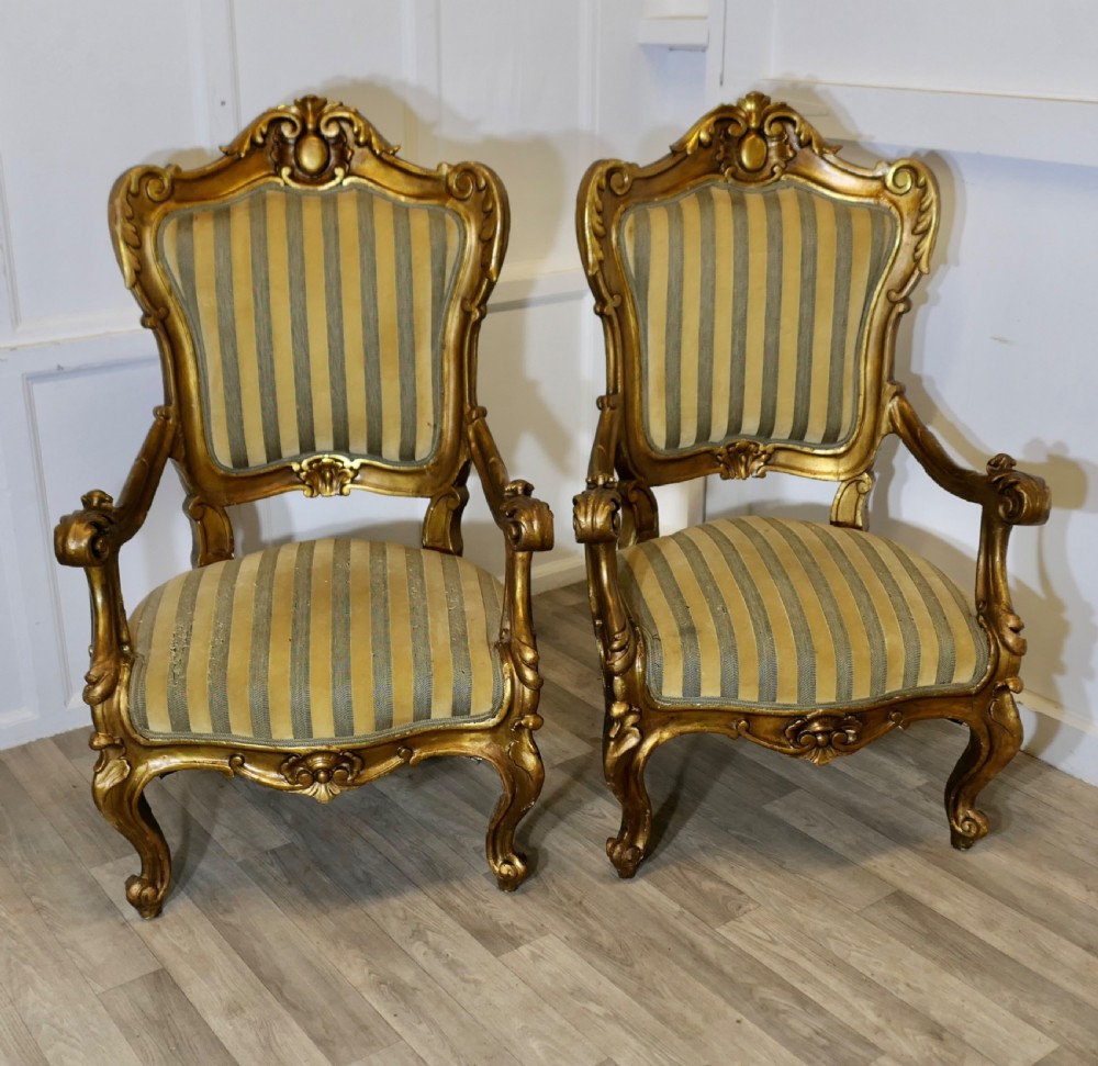 A Pair of Large Italian Carved GiltWood Arm Chairs View II