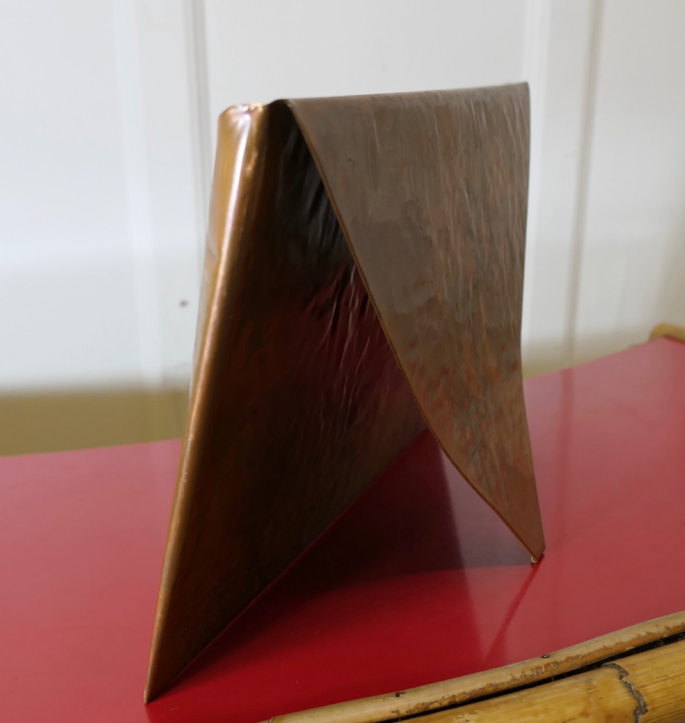 A hammered copper letter rack fashioned in the shape of an envelope, featuring a brass rivet and clasp detail. View IV